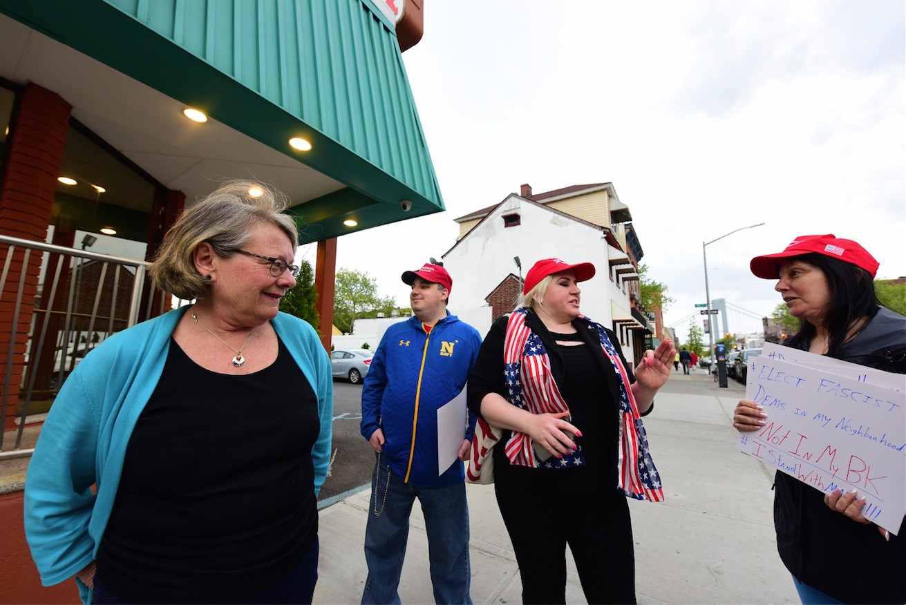 Bay Ridge Democrats member Lynn Grass (left) confronts pro-Trump demonstrators outside Bridgeview Diner on Thursday night.