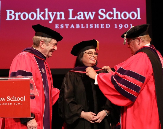 Hon. Dora Irizarry (center), Chief Judge for the Eastern District of New York, received an honorary degree from Brooklyn Law School by Dean Nicholas Allard (right) while Stuart Subotnick (left) looks on. Photos courtesy of Brooklyn Law School
