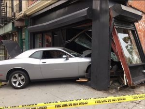 Image of the Dodge Challenger that swerved into the Cafe, sending two people to the hospital. Photos courtesy of FDNY