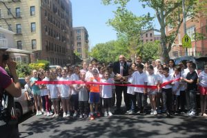 Councilmember Justin Brannan cuts the ribbon in front of a new speed bump in Bay Ridge. Eagle photos by Jaime DeJesus