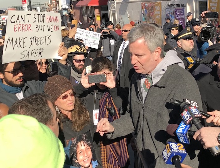 Mayor Bill de Blasio met with safe streets advocates in front of his Park Slope gym and promised changes. Eagle photo by Gersh Kuntzman