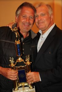 Greg Elefterakis (left) celebrates with Gregory Cerchione on Monday after his foursome won the annual Hon. Theodore T. Jones Jr. Memorial Golf Tournament hosted by the Brooklyn Bar Association. Not pictured from Elefterakis’ team are John Elefterakis, Jeff Antin and Mike Immet. Photos by Mario Belluomo