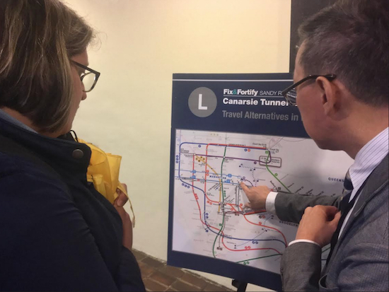 Buckley Yung, a bus planning manager for New York City Transit, shows Gina Gerhart, 29, of Bushwick, the details of the MTA’s planned transit alternatives for Brooklyn and Manhattan during next year’s shutdown of L train service between the two boroughs. Photo by Brett Dahlberg