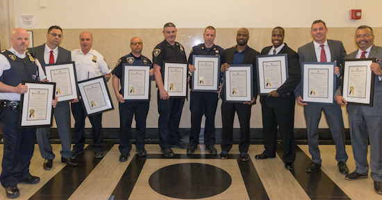 The hero court officers and clerks who helped evacuate the Brooklyn Criminal Court during a fire in May 2017 was honored yesterday. Pictured from left: John Harte, Thomas Cirola, Joseph Scafidi, Edward Rossiello, Thomas Hickey, Anthony Morgan, Darien Wagner, Shaqwan Gardner, Borough Chief Clerk Kenneth Fay and First Deputy Chief Clerk Antonio Diaz. Eagle file photos by Rob Abruzzese