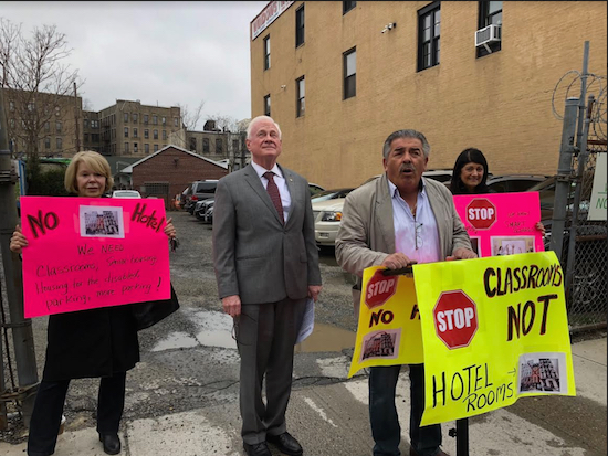 Ralph Succar (at podium) says Bay Ridge could use more classroom space instead of a hotel. In the background is state Sen. Martin Golden. Eagle photo by Paula Katinas