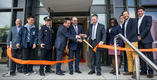Representatives from the Cammeby's real estate company and the firm S9Architecture were joined by community and police officials at the ribbon cutting. Photo courtesy of Cammeby’s