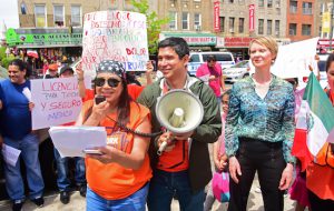 New York Communities for Change Coordinator Myriam Hernandez (left) spoke at Saturday's rally as City Councilmember Carlos Menchaca and gubernatorial candidate Cynthia Nixon looked on.