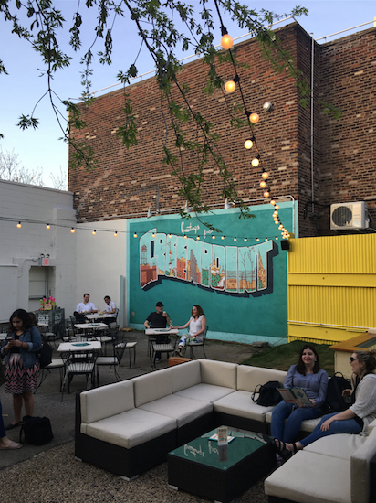 A Greenpoint mural livens up the outdoor patio at The Springs. Eagle photo by Alex Wieckowski