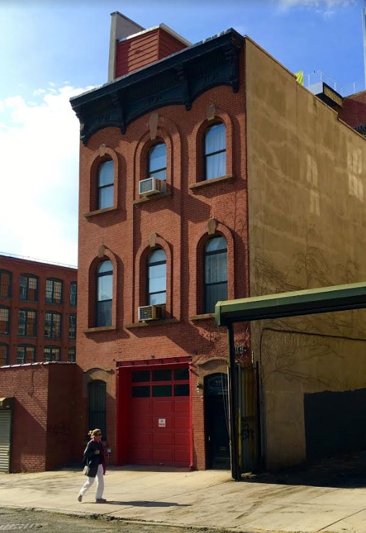 A landmarked former firehouse constructed in the 1850s shares the block with 239 Front St., a rowhouse with a duplex available for rent. 