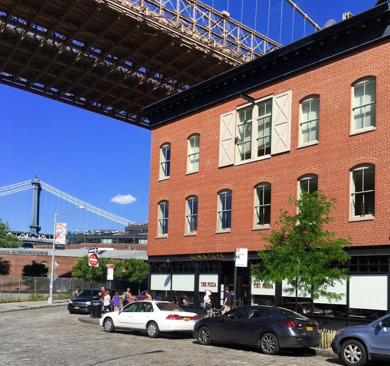The red-brick building at right, which is 4 Water St., stands thisclose to the underside of the Brooklyn Bridge. 