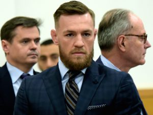 Mixed martial arts fighter Conor McGregor, center, arrives at Barclays Center, on Thursday. McGregor expressed regret on Thursday for a backstage melee at a Brooklyn arena, and is in plea negotiations to resolve charges in the case. Rashid Umar Abbasi /New York Post via AP, Pool
