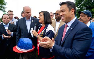 In this June 23, 2018, file photo, incumbent U.S. Rep. Dan Donovan, R-N.Y., center left, and former U.S. Rep. Michael Grimm, right, attend a property tax protest rally with New York State Assembly member Nicole Malliotakis, R-Staten Island, center, in the Staten Island borough of New York. Grimm and Donavan are running against one another in the Republican Congressional primary for the 11th Congressional District. AP Photo/Craig Ruttle, File
