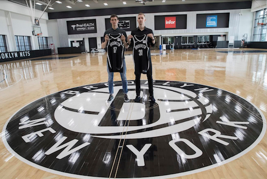 The two newest Nets, first-round draft pick Dzanan Musa (left) and Rodions Kurucs, show off their Brooklyn jerseys last Friday at the team’s HSS Training Center in Sunset Park. AP Photo by Mary Altaffer