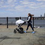 A mother strolls with her baby along the Brooklyn Heights Promenade, one of seven high-traffic Brooklyn locations identified by the borough president as sites for the installation of protective anti-terror bollards. Eagle photo by Mary Frost