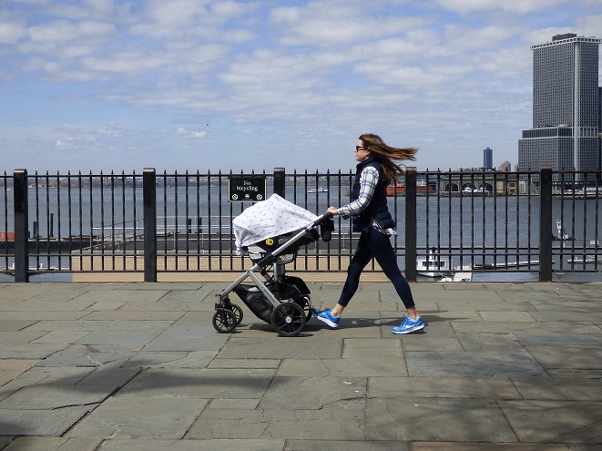 A mother strolls with her baby along the Brooklyn Heights Promenade, one of seven high-traffic Brooklyn locations identified by the borough president as sites for the installation of protective anti-terror bollards. Eagle photo by Mary Frost