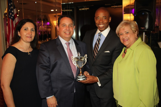 Joseph Rosato (second from left), past president of the Catholic Lawyers Guild of Kings County and incoming president of the Columbian Lawyers Association of Brooklyn, received the Man of the Year Award at the annual Shorefront Democratic Club Dinner. Rosato is pictured with (from left) his wife Fran Rosato, Borough President Eric Adams and District Leader Dilia Schack. Eagle photos by Mario Belluomo