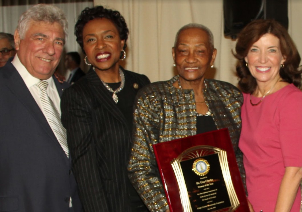 Hon. Frank Seddio, Kathy Hochul (right) and U.S. Rep. Yvette Clarke (second from left) present Dr. Una S.T. Clarke with the Woman of the Year Award.