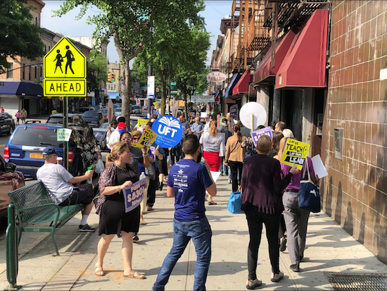 Teachers and school administrators protested outside State Sen. Marty Golden’s office on Friday, June 1, demanding his support for legislation that would allow for the decoupling of teacher evaluations from student results on standardized tests. Photo by Brandon Sapienza
