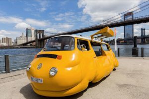 Erwin Wurm’s “Hot Dog Bus,” a modified, vintage Volkswagen Microbus that has been transformed into a bloated and bizarre hot dog stand will pass out free hot dogs all summer. Photo - Liz Ligon, Courtesy Public Art Fund, NY