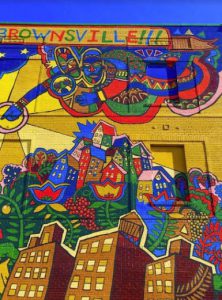 This mural on Herzl Street proclaims, “Welcome to Brownsville!!!” Eagle photo by Lore Croghan