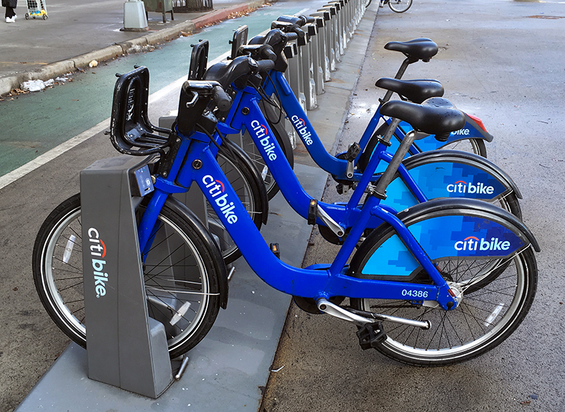 Another 1.6 million people are now eligible for low-cost Citi Bike memberships, now that New York City has expanded the program to SNAP (food stamp) recipients. Shown: Citi Bikes in Brooklyn Heights.  Eagle photo by Mary Frost