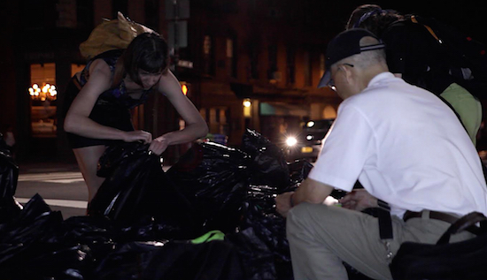 Freegans exploring Downtown Brooklyn’s street-side commercial garbage. Eagle photos by Liliana Bernal