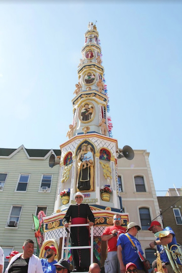 Monsignor Jamie Gigantiello clearly enjoys this year’s Giglio Festival, his first as pastor of Our Lady of Mt. Carmel parish in Williamsburg. Eagle photo by Mario Belluomo