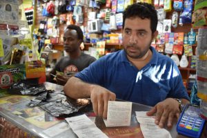 Jameel Zaid, co-owner of a bodega in East Flatbush, sends up to $2,000 a month to his wife and children, stranded overseas by the travel ban. Photo by Graison Dangor