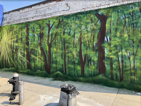 “These woods are lovely, dark and deep,” poet Robert Frost wrote. Pedestrians can enjoy the view of Jenna Morello’s mural on 90th Street just off Fifth Avenue. Eagle photo by Paula Katinas