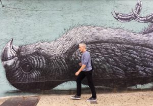 Williamsburg's Lorimer Street is a visitor magnet. This is its intersection with Metropolitan Avenue, outside a subway station entrance. Eagle photos by Lore Croghan