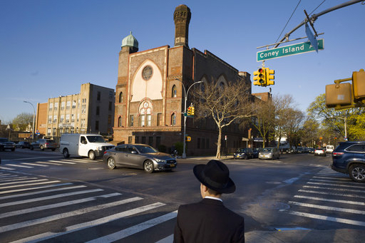 In this April 26 photo, a Jewish boy walks to a yeshiva in Brooklyn. Critics say dozens of New York's ultra-Orthodox Jewish schools run by Hasidic Jews are failing to provide enough instruction in English, math or other secular subjects to prepare students for the modern world. A group that's pushing for more secular instruction in the yeshivas filed a lawsuit Monday in federal court in Brooklyn over the issue. AP Photo/Mark Lennihan