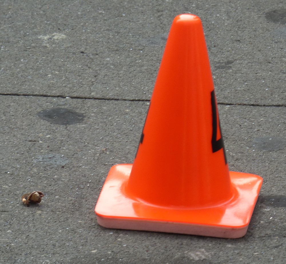 What appeared to be a mangled bullet was marked by a small red NYPD cone labeled with the number 4. By Mary Frost 