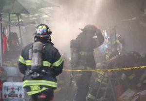 The scene of a three-alarm fire that, as of 4:40 p.m., was still being handled by first responders. Photos by Loudlabs News NYC