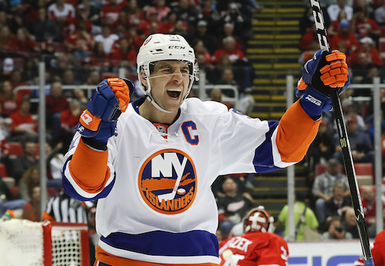 In this Feb. 21, 2017, file photo, New York Islanders center John Tavares (91) celebrates his goal against the Detroit Red Wings in the third period of an NHL hockey game, in Detroit. Superstar center John Tavares is going home, agreeing to terms on a $77 million, seven-year contract with his childhood team, the Toronto Maple Leafs. Tavares announced his intentions on Twitter on Sunday, July 1, 2018. AP Photo/Paul Sancya, File