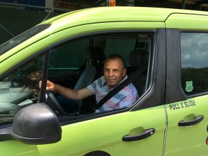 The New York City Council is considering several bills that would temporarily restrict the number of Uber and Lyft vehicles allowed on the road. Green cab driver Majed Al-Fallaj, shown above, says it’s about time the city reins in Uber, which he blames for killing the traditional taxi business. Eagle photo by Mary Frost