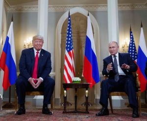 Russian President Vladimir Putin, right, makes a statement as U.S. President Donald Trump looks on at the start of their meeting in Helsinki on Monday. AP Photo/Pablo Martinez Monsivais