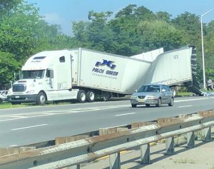 A damaged tractor trailer between Exits 5 and 6 on the Belt Parkway Tuesday morning. Photos courtesy of Marc Hibscher