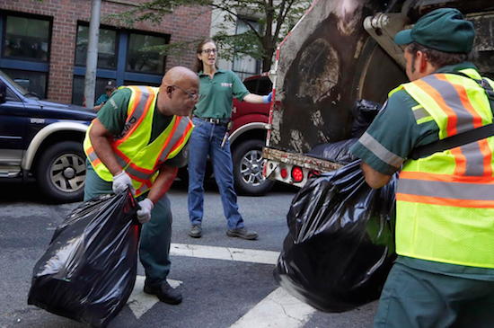 Sanitation workers did not pick up compost in Cobble Hill on Tuesday, leaving residents fuming as the organic waste rotted in the summer heat and attracted insects. AP Photo/Richard Drew
