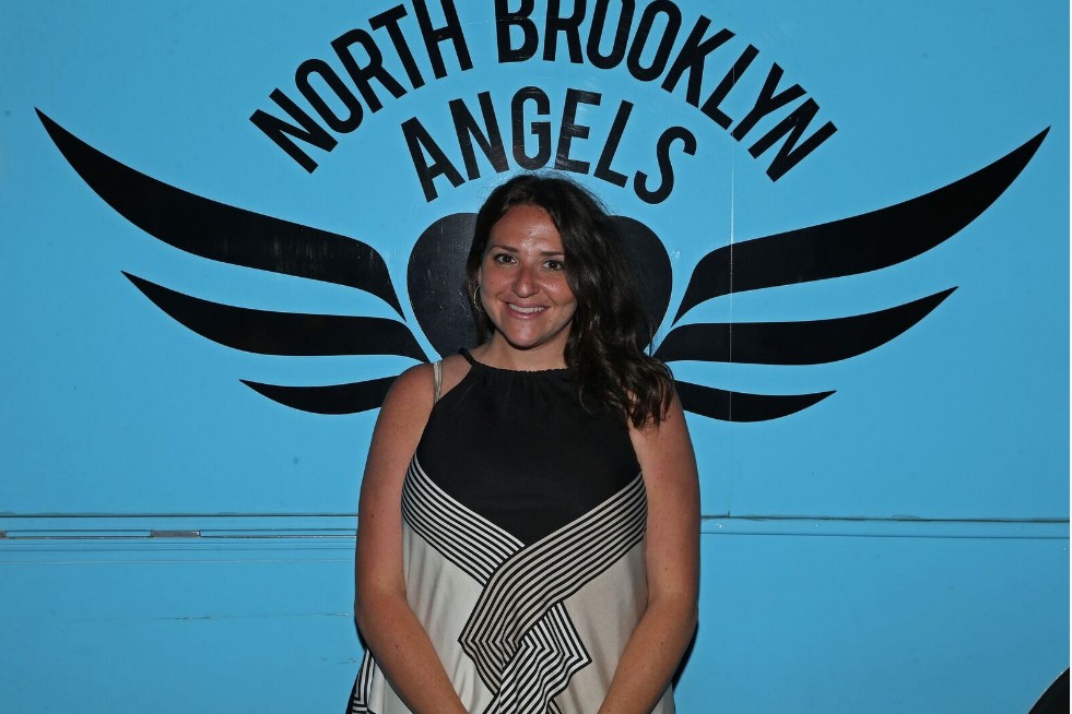 NYC Together Founder and CEO Dana Rachlin gets her “wings” outside the North Brooklyn Angels food truck