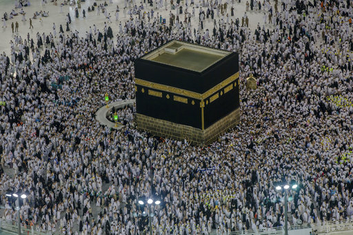 Muslim pilgrims perform the tawaf-e-ifadha circling of the Kaaba, during the annual Haj pilgrimage on the first day of Eid al-Adha in Mecca, Saudi Arabia, on Tuesday. The five-day pilgrimage represents one of the five pillars of Islam and is required of all able-bodied Muslims once in their life. AP Photo/Dar Yasin