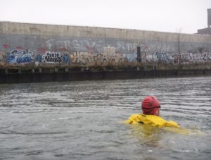 Chris Swain has swum some of America’s most toxic waterways, including the Gowanus Canal three times. Yet out of all of his plunges, Newtown Creek was the most horrifying, he said. Photo courtesy of Chris Swain