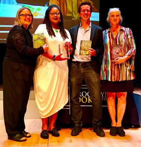 Novelist N.K. Jemisin, second from left, holds her BoBi Award. At far left is Brooklyn Book Festival Co-Producer Carolyn Greer. Brooklyn Literary Council Chairman Johnny Temple is second from right and Brooklyn Book Festival Co-Producer Liz Koch stands next to him. Eagle photo by Lore Croghan