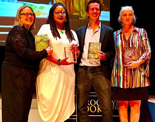 Novelist N.K. Jemisin, second from left, holds her BoBi Award. At far left is Brooklyn Book Festival Co-Producer Carolyn Greer. Brooklyn Literary Council Chairman Johnny Temple is second from right and Brooklyn Book Festival Co-Producer Liz Koch stands next to him. Eagle photo by Lore Croghan