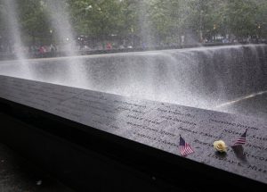 Wind sprays mist over the rim of the South Pool of the 9/11 Memorial. AP Photo/Craig Ruttle