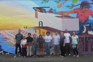 The artists who created this mural at the Bush Terminal with Councilmember Carlos Menchaca. Eagle photo by Jaime DeJesus