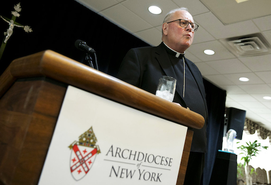 Cardinal Timothy Dolan listens to a question at a news conference at the offices of the New York Archdiocese, on Thursday. The Roman Catholic Archdiocese of New York said Thursday that it has hired former federal judge Barbara Jones to review its procedures and protocols for handling allegations of sexual abuse. AP Photo/Richard Drew