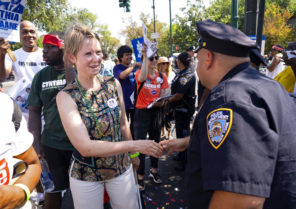 Democratic New York gubernatorial candidate Cynthia Nixon greets a New York City police officer