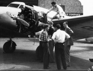 Amelia Earhart (lower left) speaks with her husband and friends before taking off from Floyd Bennett Field for Los Angeles in 1936. A 1939 plan would have brought the subway to the now-defunct airport. AP file photo