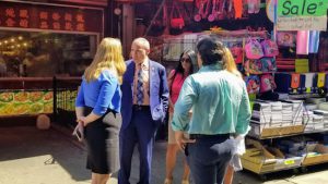 Sanitation Commissioner Kathryn Garcia (left) and Councilmember Mark Treyger (second from left) discuss their findings with other officials after taking a tour of 86th Street to inspect trash problems. Photo courtesy of Councilmember Treyger’s office