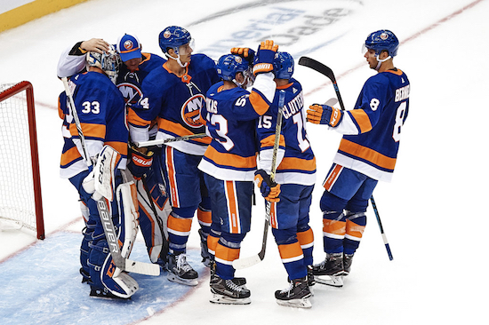 New York Islanders players celebrate their victory after a preseason NHL hockey game against the Philadelphia Flyers on Sunday. AP Photo/Andres Kudacki